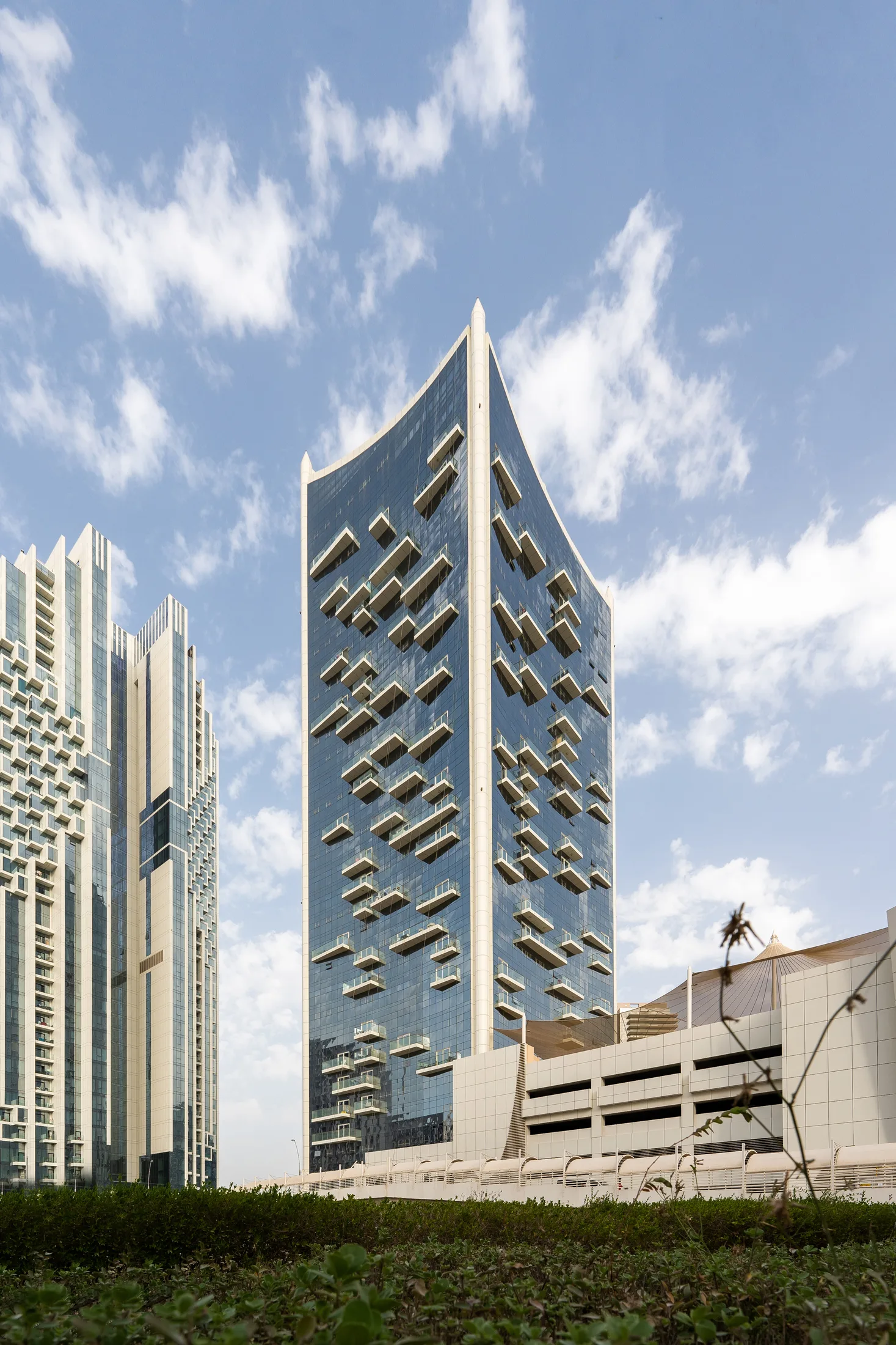 An angular faceted residential tower in Abu Dhabi, photographed for Q Holding