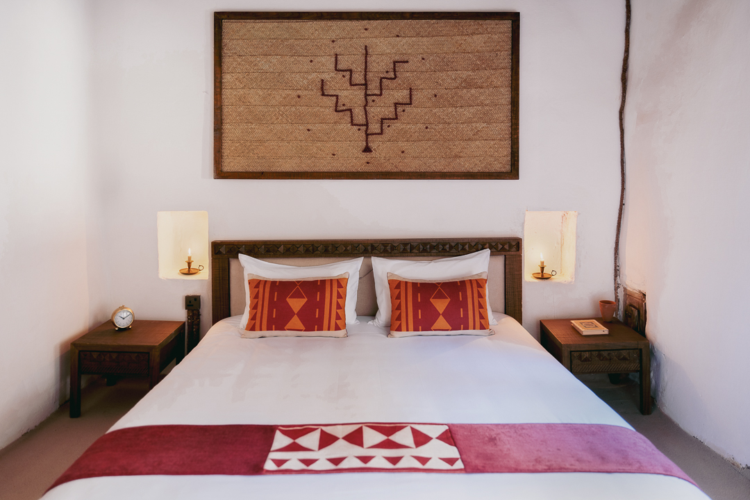 A guest room at Dar Tantora The House Hotel, AlUla, restored from an abandoned mud brick house